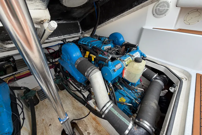 Slide: The Image of Engine compartment of a 2001 Tiara Yachts 2900 Coronet, showcasing blue marine engine. - 21