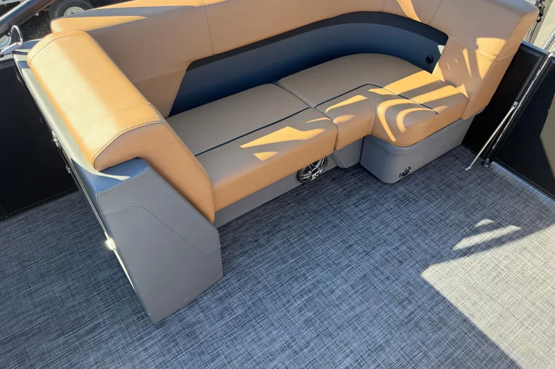 Slide: The Image of Luxurious seating on 2027 Whisper Drift RLS boat, featuring tan and gray upholstery. - 16