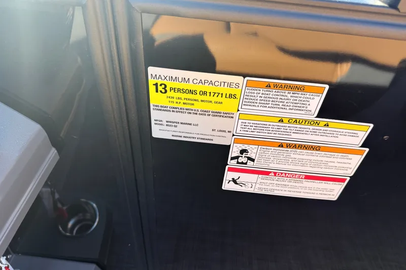 Slide: The Image of Boat capacity and safety warnings on Whisper Drift RLS 2027 model. - 13