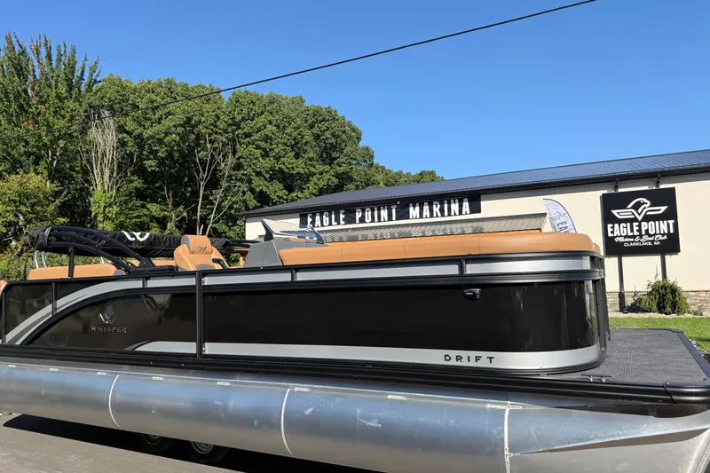 Slide: The Image of 2027 Whisper Drift RLS pontoon boat at Eagle Point Marina, sunny day. - 2