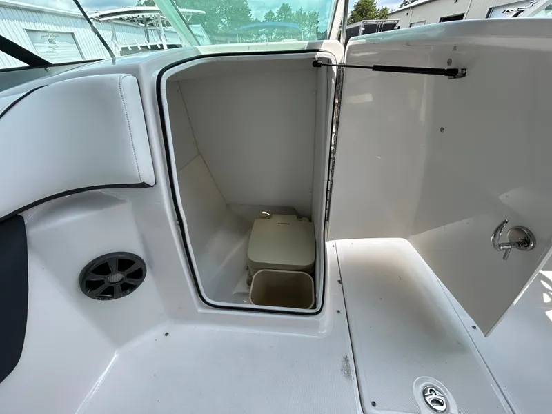 Slide: The Image of The image shows the interior of a boat compartment with a portable toilet. - 15