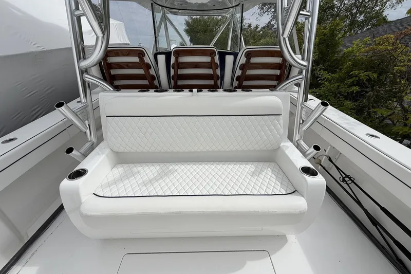 Slide: The Image of 2022 Valhalla Boatworks V-41 interior with white quilted seating and rod holders. - 27