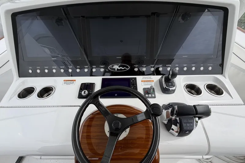 Slide: The Image of 2022 Valhalla Boatworks V-41 helm with advanced navigation displays and controls. - 14