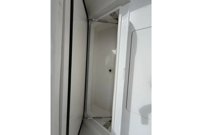Slide: The Image of 2022 Valhalla Boatworks V-41 storage compartment with hydraulic hinges and drain. - 29