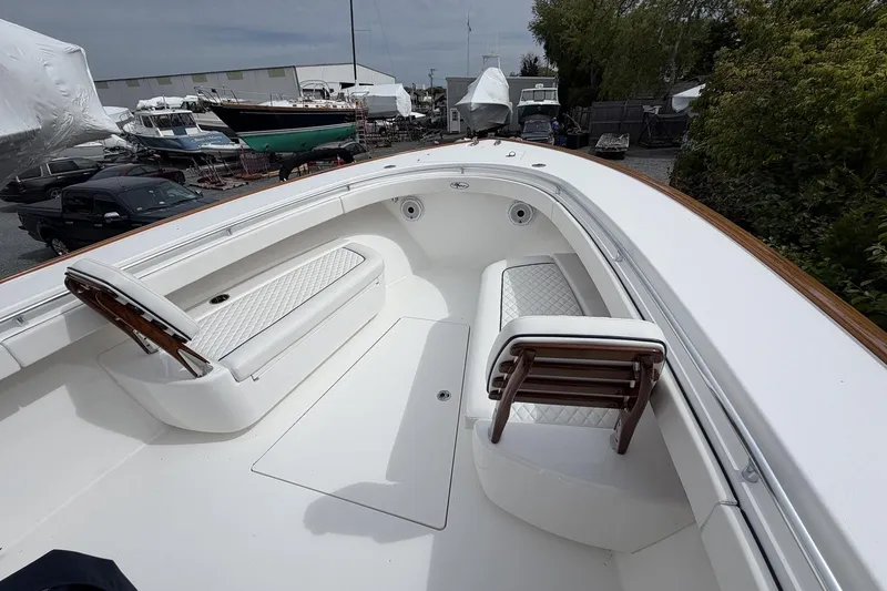 Slide: The Image of 2022 Valhalla Boatworks V-41 interior with white seating and wooden accents. - 23
