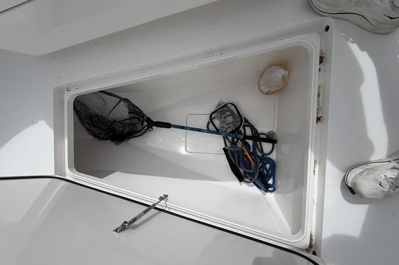 Slide: The Image of Storage compartment on 2022 Valhalla Boatworks V-41 with fishing net and rope. - 26