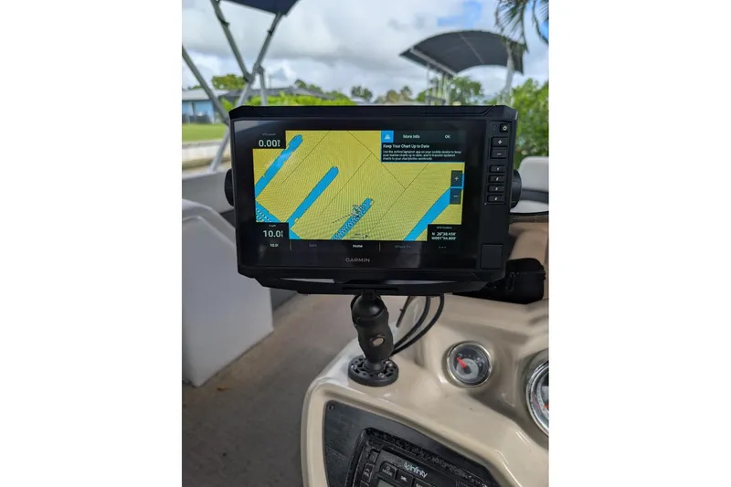 Slide: The Image of Garmin navigation system on 2019 Avalon 2485LSZ boat dashboard, displaying nautical map. - 10