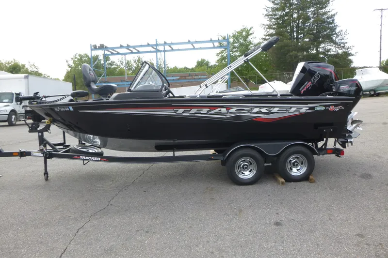 The Image of 2023 Tracker Targa V-19 Combo boat on trailer, parked outdoors. - 1