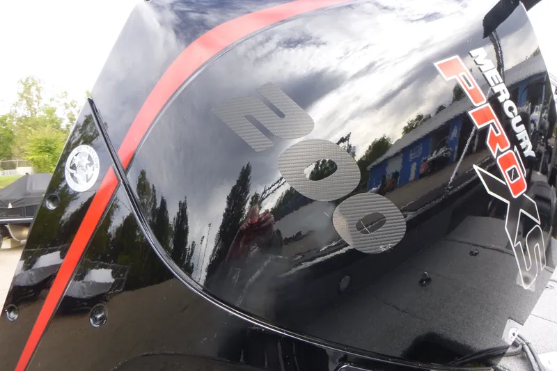 Slide: The Image of Mercury Pro XS engine on 2023 Tracker Targa V-19 Combo boat, reflecting surroundings. - 17