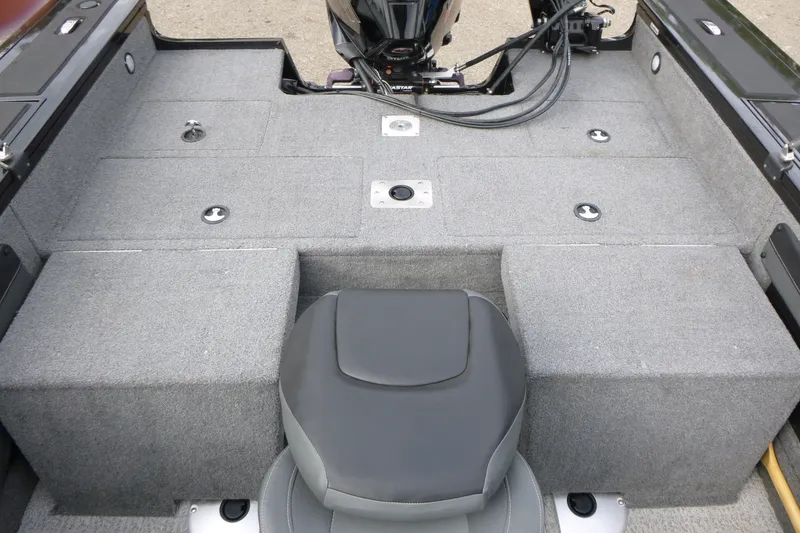 Slide: The Image of 2023 Tracker Targa V-19 Combo boat interior with gray carpet and seating. - 14