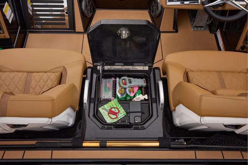 Slide: The Image of Manufacturer Provided Image: 2026 Ranger Z521R ULTRA boat interior with storage compartment and tan seats. - 57