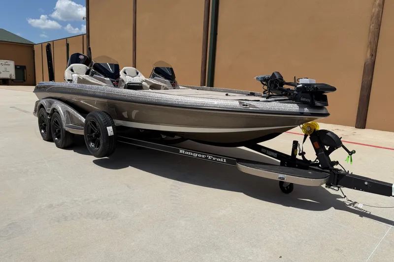Slide: The Image of 2026 Ranger Z521R Ultra fishing boat on trailer, parked outdoors. - 5