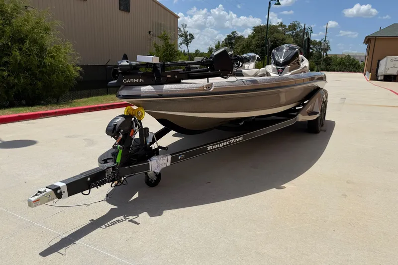 Slide: The Image of 2026 Ranger Z521R Ultra boat on trailer, equipped with Garmin technology, parked outdoors. - 2