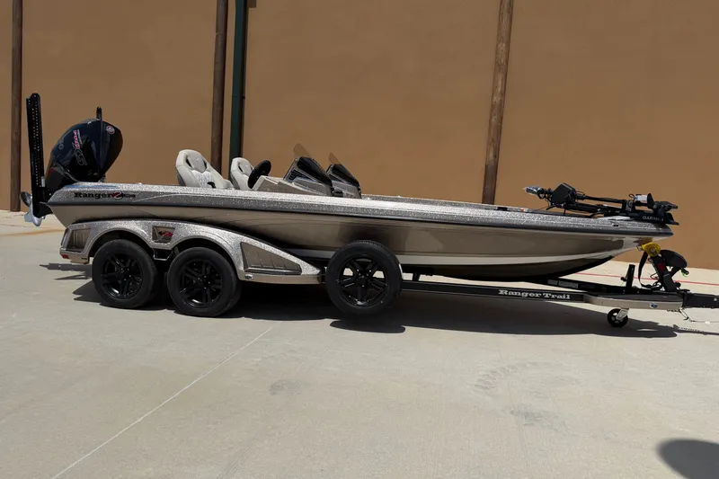 Slide: The Image of 2026 Ranger Z521R Ultra boat on trailer, parked outdoors, side view. - 0
