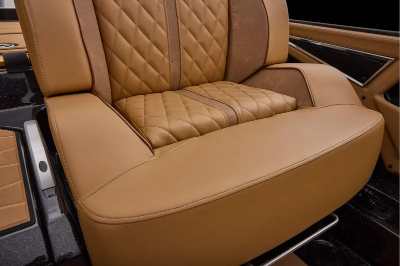 Slide: The Image of Manufacturer Provided Image: Luxurious tan leather seat in 2026 Ranger Z521R ULTRA boat interior. - 51