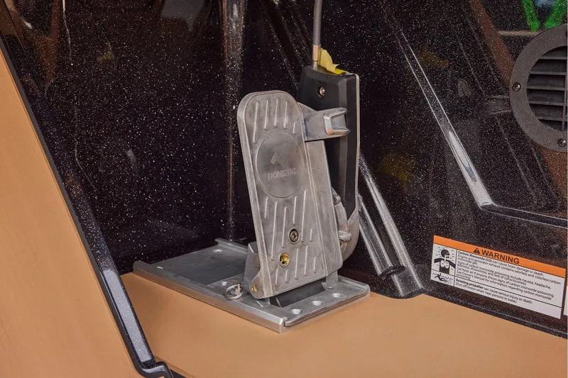 Slide: The Image of Manufacturer Provided Image: Foot pedal mechanism in 2026 Ranger Z521R ULTRA boat, featuring Dometic branding and warning label. - 47