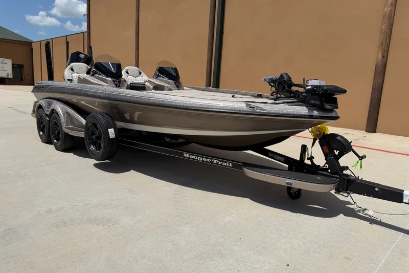 Slide: The Image of 2026 Ranger Z521R Ultra fishing boat on trailer, parked outdoors. - 1