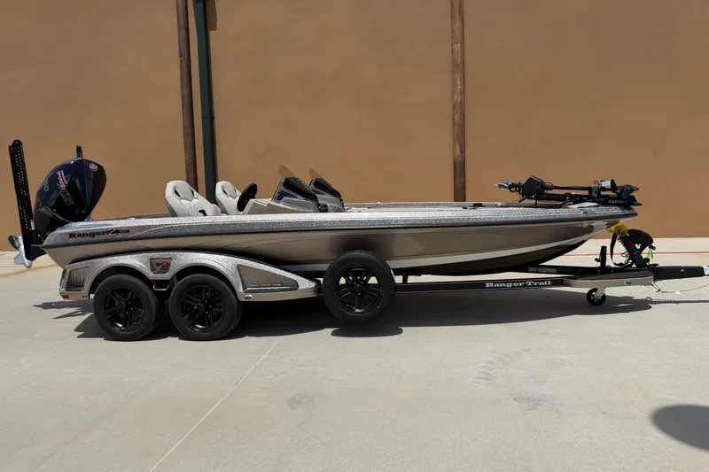 Slide: The Image of 2026 Ranger Z521R Ultra boat on trailer, side view, parked outdoors. - 6