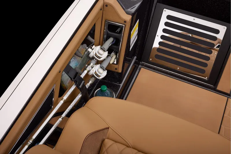Slide: The Image of Manufacturer Provided Image: 2026 Ranger Z521R ULTRA boat interior with fishing rod storage and tan seating. - 55