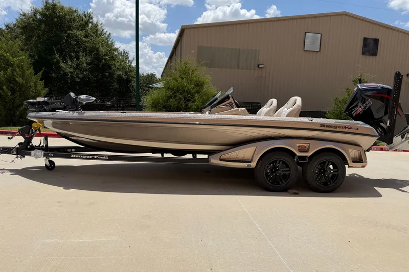 Slide: The Image of 2026 Ranger Z521R Ultra fishing boat on trailer, parked outdoors. - 9