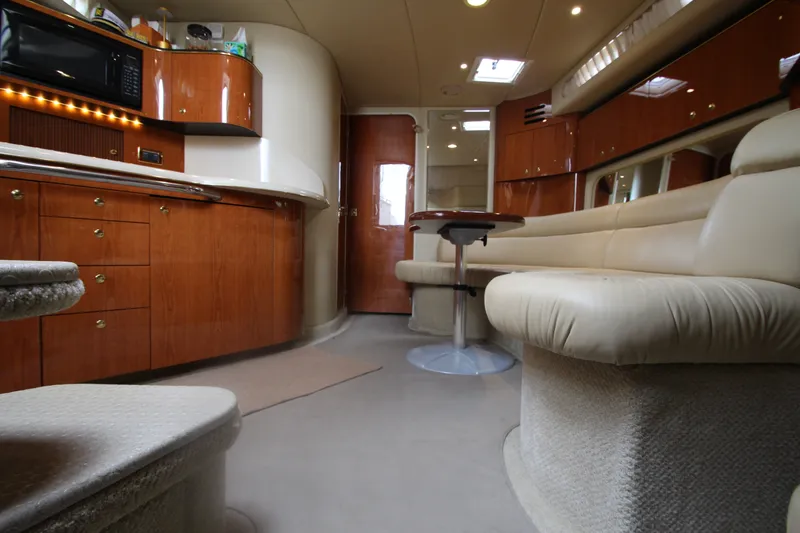 Slide: The Image of Luxurious interior of a 2001 Sea Ray 380 Sundancer yacht with elegant wood cabinetry. - 28