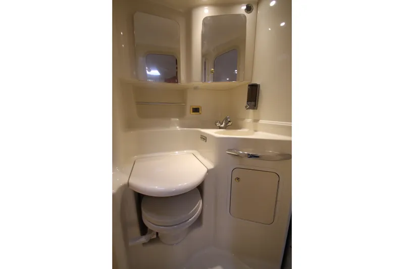 Slide: The Image of Compact bathroom in 2001 Sea Ray 380 Sundancer yacht with toilet and sink. - 41