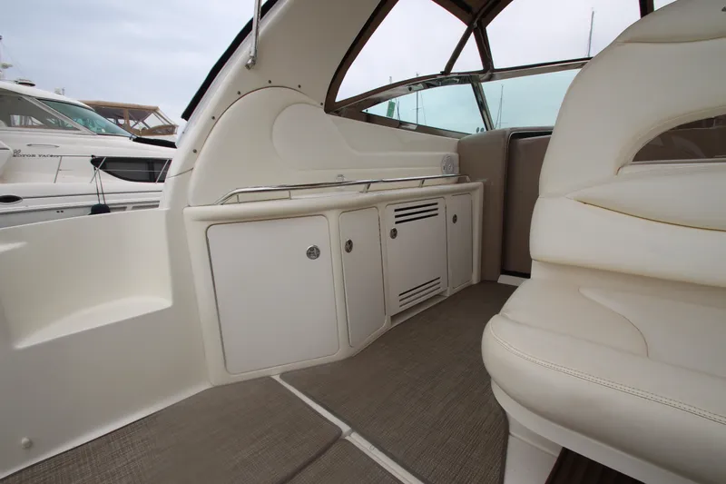 Slide: The Image of Interior view of a 2001 Sea Ray 380 Sundancer yacht with beige seating and cabinetry. - 19