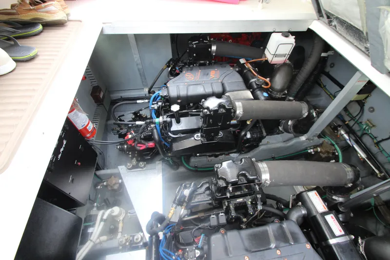 Slide: The Image of Engine compartment of a 2001 Sea Ray 380 Sundancer boat, showcasing dual engines. - 51