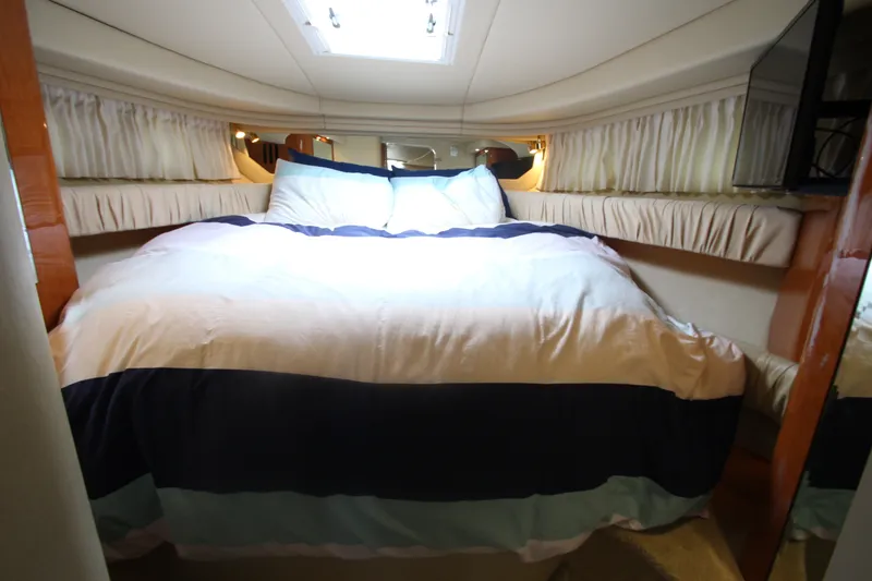 Slide: The Image of Luxurious cabin interior of 2001 Sea Ray 380 Sundancer yacht with cozy bedding. - 33