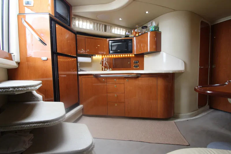 Slide: The Image of Luxurious 2001 Sea Ray 380 Sundancer yacht interior with modern kitchen amenities. - 29