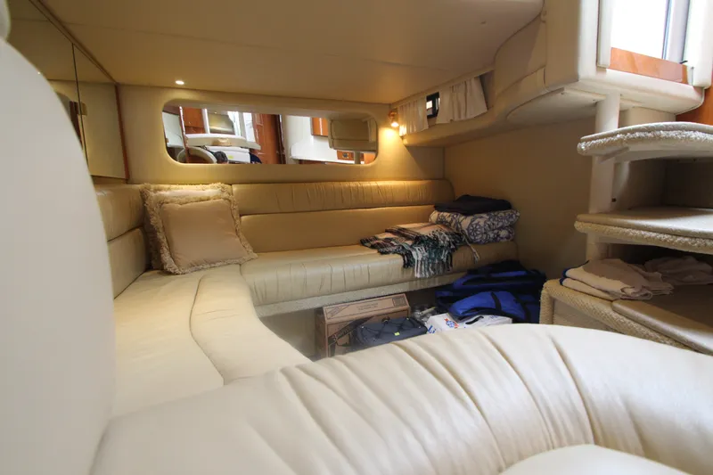 Slide: The Image of Interior of 2001 Sea Ray 380 Sundancer yacht with cozy seating and soft lighting. - 49