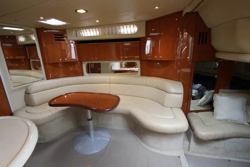 Slide: The Image of Luxurious interior of 2001 Sea Ray 380 Sundancer yacht with elegant seating and wooden accents. - 32