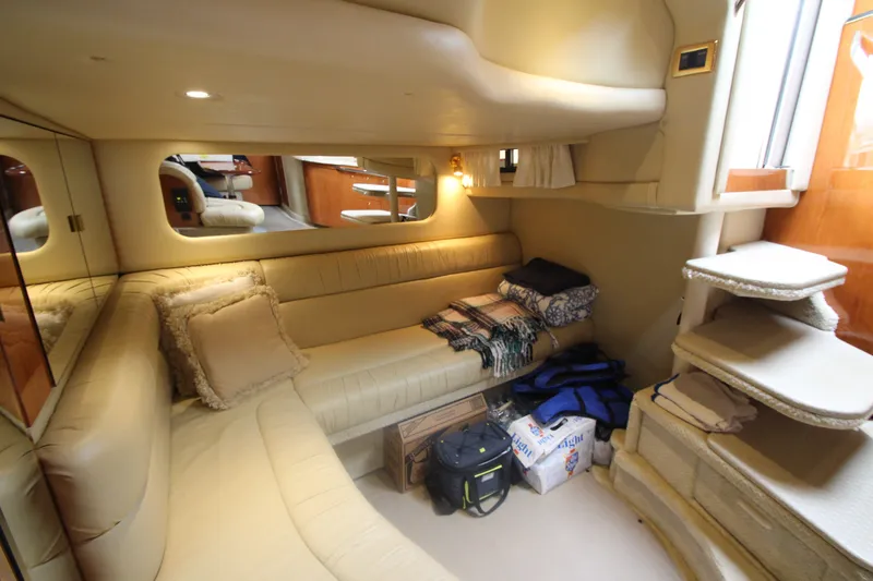 Slide: The Image of Luxurious interior of 2001 Sea Ray 380 Sundancer yacht with cozy seating and elegant decor. - 48