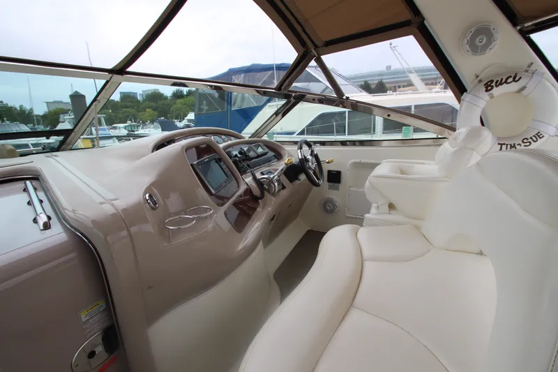 Slide: The Image of 2001 Sea Ray 380 Sundancer helm with luxurious seating and modern controls. - 22