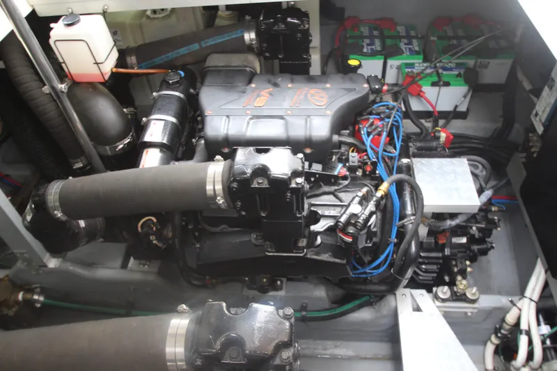 Slide: The Image of Engine compartment of a 2001 Sea Ray 380 Sundancer with visible components and wiring. - 54