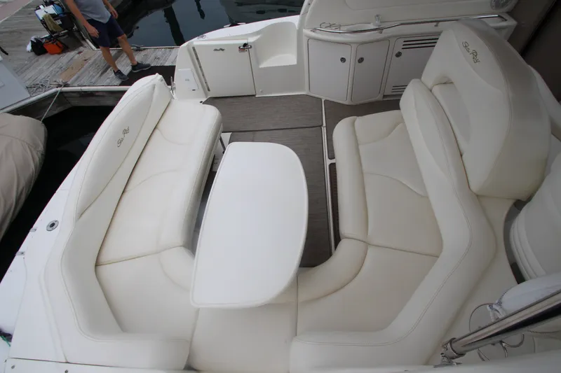 Slide: The Image of 2001 Sea Ray 380 Sundancer boat interior with white seating and table. - 16