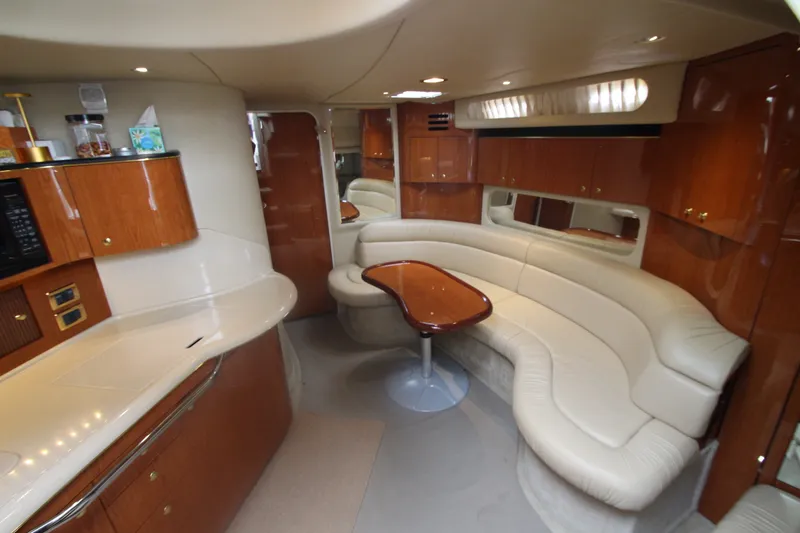 Slide: The Image of Luxurious interior of 2001 Sea Ray 380 Sundancer yacht with elegant seating and cabinetry. - 25