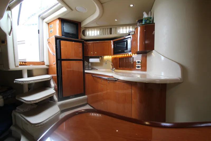 Slide: The Image of Luxurious 2001 Sea Ray 380 Sundancer yacht interior with modern kitchen amenities. - 44