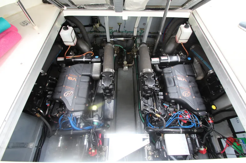 Slide: The Image of Engine compartment of a 2001 Sea Ray 380 Sundancer with twin V8 engines. - 50