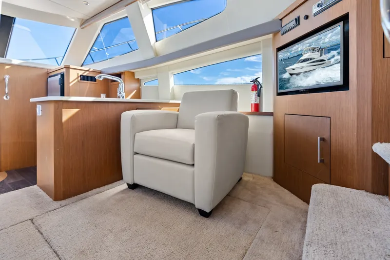 Slide: The Image of Luxurious interior of 2012 Carver 41 Cockpit Motor Yacht with modern furnishings. - 29