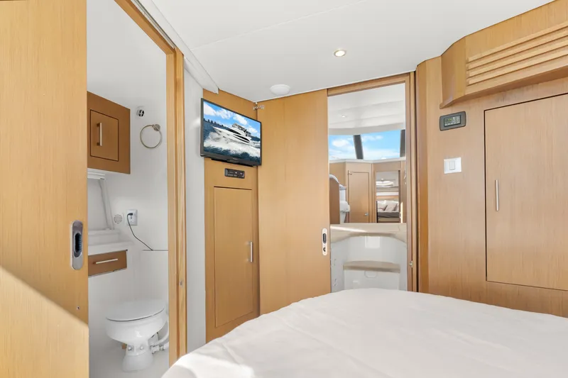 Slide: The Image of Interior of 2012 Carver 41 Cockpit Motor Yacht with modern wood finishes and amenities. - 38