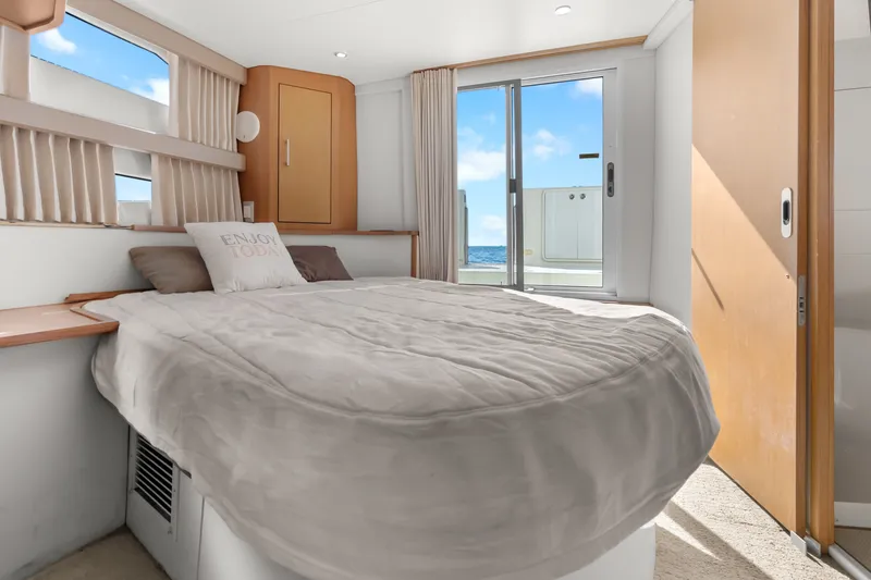 Slide: The Image of Luxurious bedroom in 2012 Carver 41 Cockpit Motor Yacht with ocean view. - 35