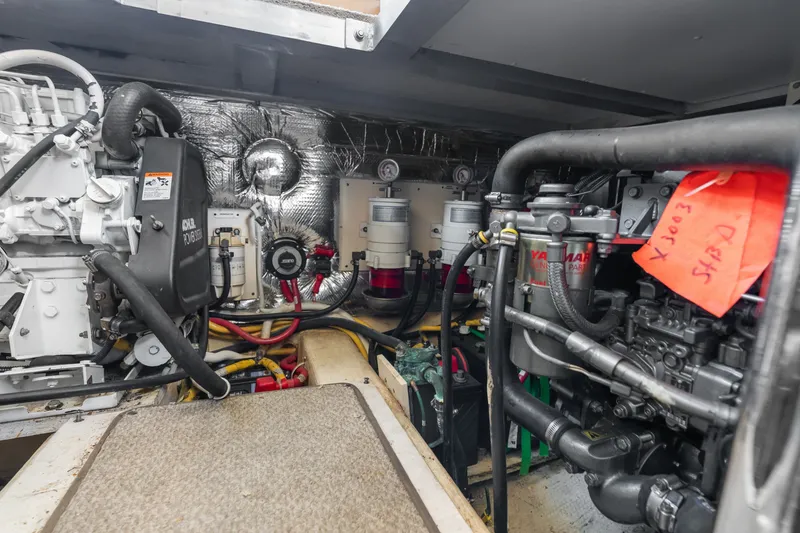 Slide: The Image of Engine room of 2012 Carver 41 Cockpit Motor Yacht, showcasing mechanical components. - 47