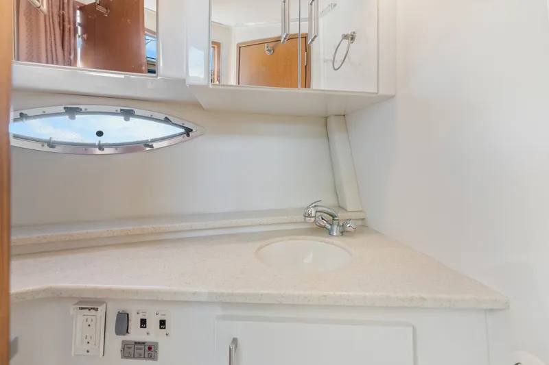 Slide: The Image of Bathroom vanity in 2012 Carver 41 Cockpit Motor Yacht with sink and mirror. - 41