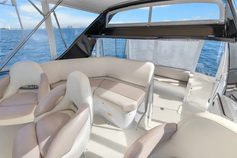Slide: The Image of Luxurious interior of 2012 Carver 41 Cockpit Motor Yacht with beige seating and ocean view. - 16