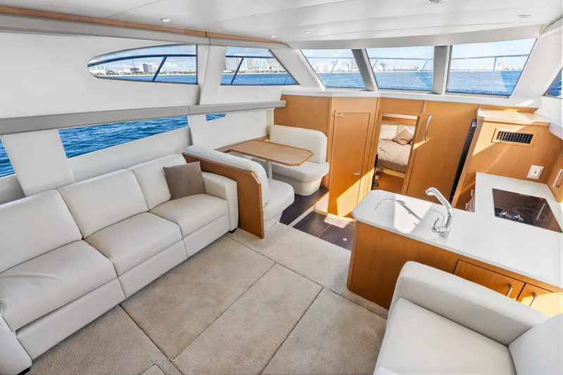 Slide: The Image of Luxurious interior of 2012 Carver 41 Cockpit Motor Yacht with modern furnishings and scenic views. - 30
