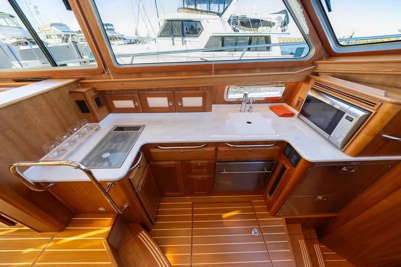 Slide: The Image of Luxurious kitchen interior of 2021 Sabre 45 Salon Express yacht with wood cabinetry. - 20