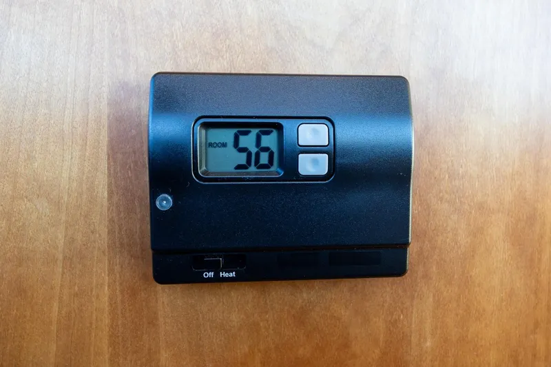Slide: The Image of Thermostat displaying 56 degrees on a 2021 Sabre 45 Salon Express yacht. - 35