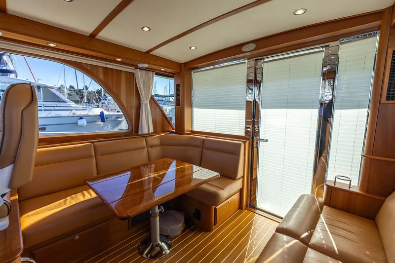Slide: The Image of Luxurious interior of 2021 Sabre 45 Salon Express yacht with leather seating and wooden finishes. - 14