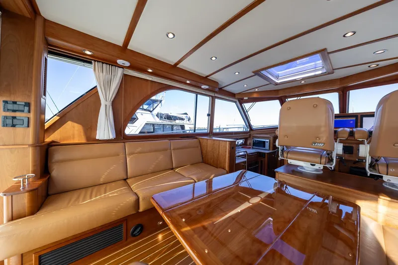 Slide: The Image of Luxurious interior of 2021 Sabre 45 Salon Express yacht with leather seating and wood finishes. - 15